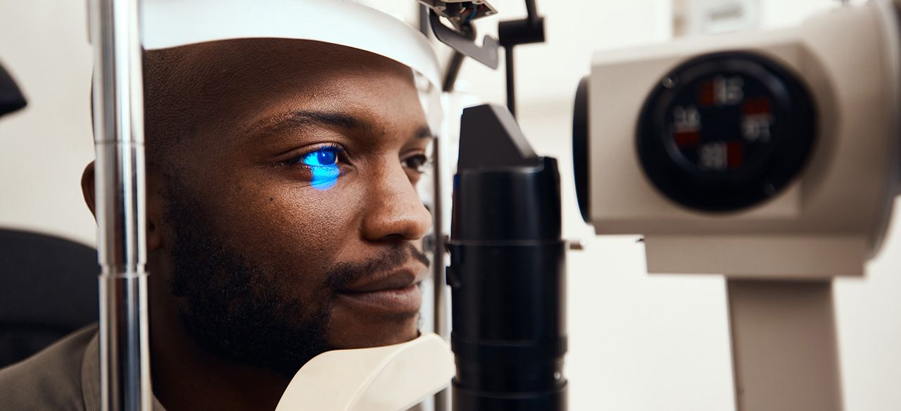 A patient at an eye exam instrument