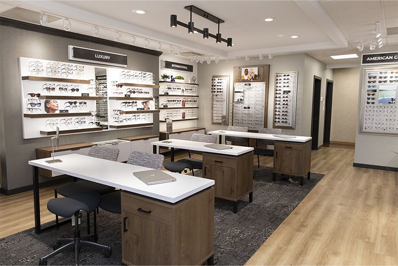 The renovated optical shop with fitting tables and frame walls